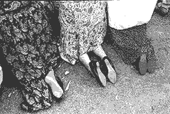 Women kneeling at Conyers farm. Photo by Victor Balaban